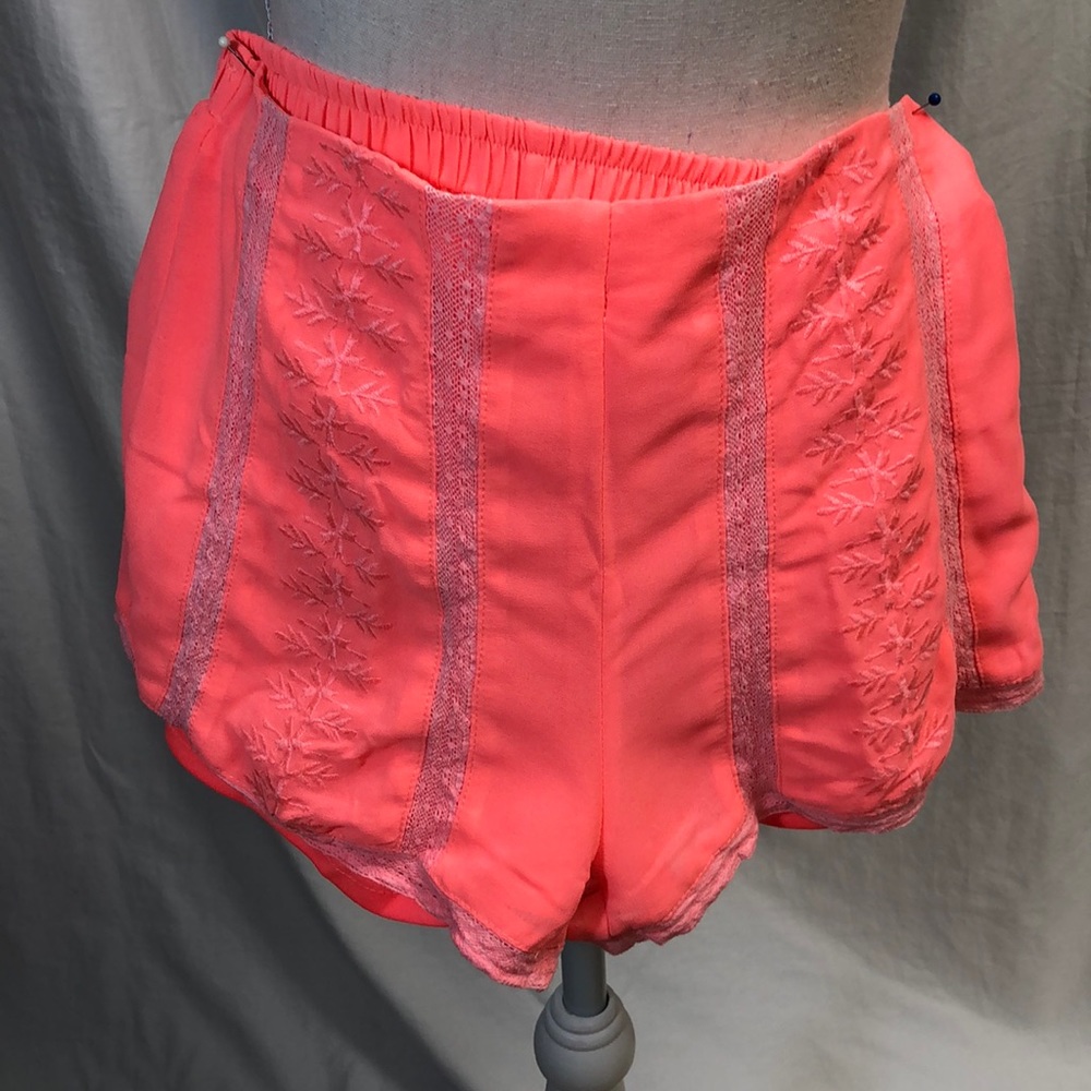 Hot pink lined slinky shorts w/lace trimmed edge.